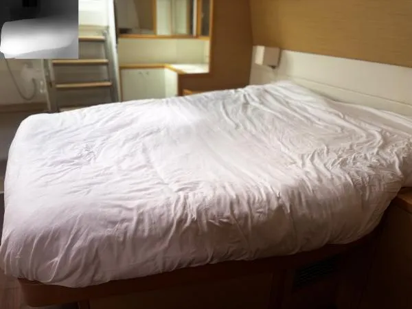 Slide: The Image of Interior cabin of 2012 Lagoon 560 yacht with a neatly made bed. - 17