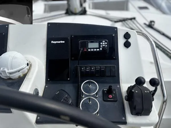 Slide: The Image of Control panel of a 2012 Lagoon 560 yacht with Raymarine equipment and navigation controls. - 27