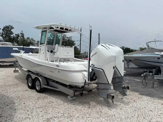 Slide: The Image of 2022 Caymas 28 Twin boat on trailer with dual outboard engines. - 3