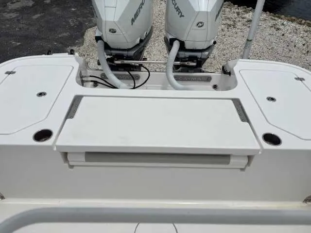 Slide: The Image of 2022 Caymas 28 Twin boat with dual Mercury engines, rear deck view. - 8
