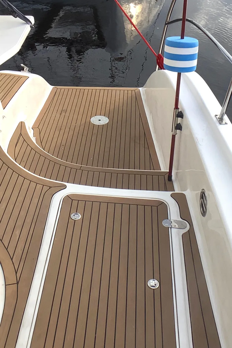 Slide: The Image of Deck of 2021 Royal Cape Catamarans Majestic 570 Flybridge with teak flooring. - 33