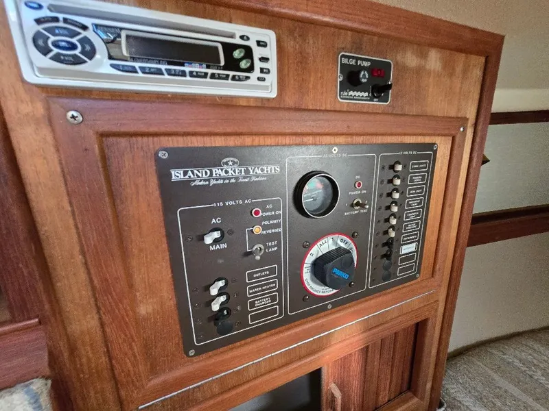 Slide: The Image of Control panel of a 1986 Island Packet IP27 yacht with bilge pump and stereo system. - 8