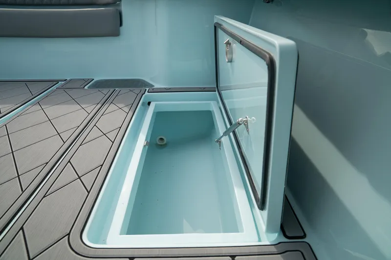 Slide: The Image of Open storage compartment on 2026 Front Runner 39 CC boat deck. - 16