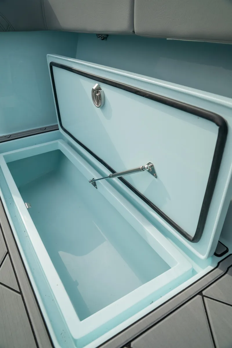 Slide: The Image of 2026 Front Runner 39 CC boat storage compartment with open lid, showcasing interior space. - 17