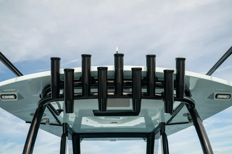 Slide: The Image of 2026 Front Runner 39 CC boat with multiple rod holders against a blue sky. - 20