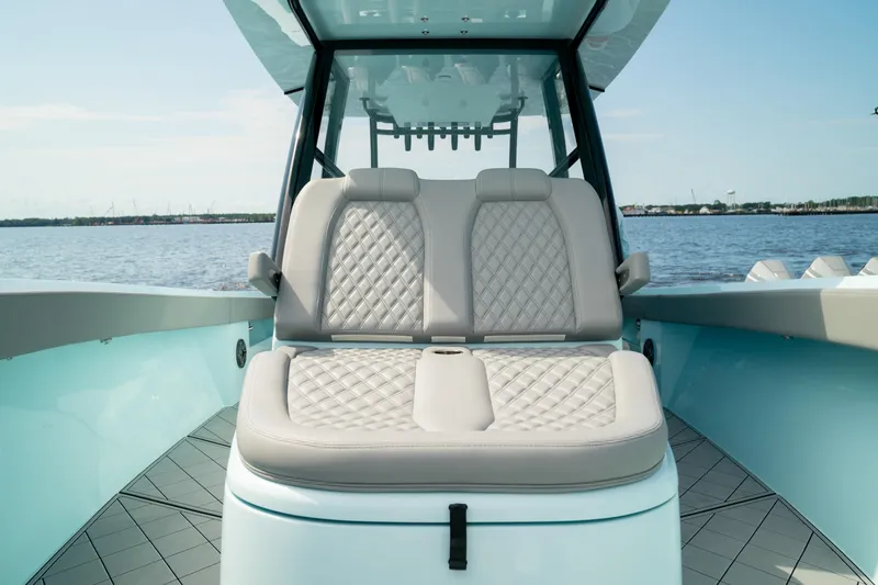 Slide: The Image of 2026 Front Runner 39 CC boat with luxurious seating, on calm water. - 3