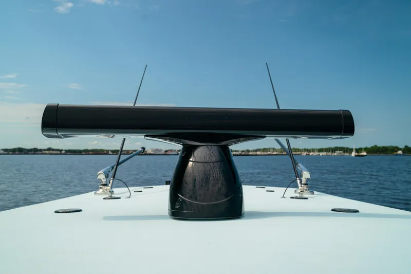 Slide: The Image of 2026 Front Runner 39 CC boat radar on calm water under blue sky. - 7