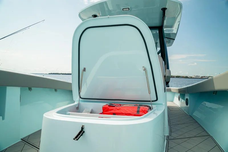 Slide: The Image of 2026 Front Runner 39 CC boat with open storage compartment and life jacket. - 9