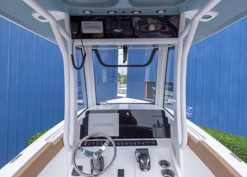 Slide: The Image of 2026 Sea Hunt Ultra 245 SE boat dashboard with Garmin navigation system. - 7