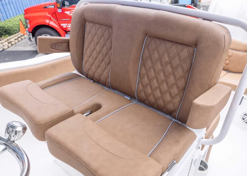 Slide: The Image of 2026 Sea Hunt Ultra 245 SE boat seats with brown upholstery and diamond stitching. - 8