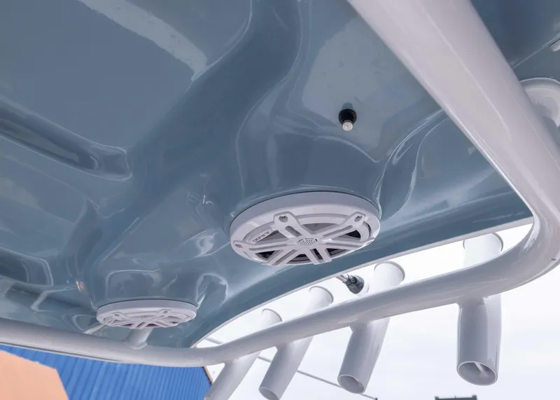 Slide: The Image of 2026 Sea Hunt Ultra 245 SE boat speakers and rod holders on T-top. - 9