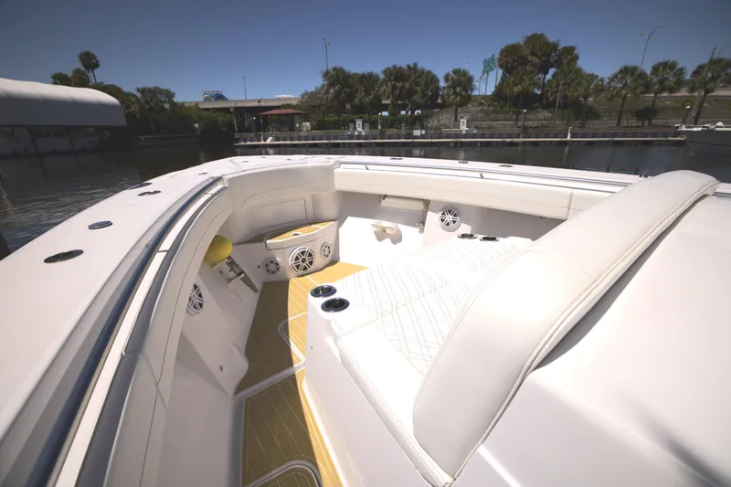 Slide: The Image of 2025 Century NAV4100 CC-H boat interior with white seating and speakers. - 16