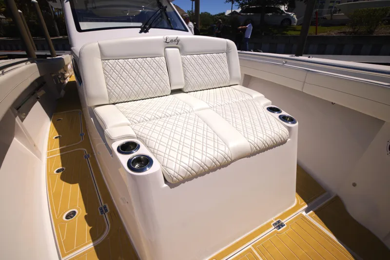 Slide: The Image of Luxurious seating on 2025 Century NAV4100 CC-H boat with quilted upholstery and cup holders. - 17