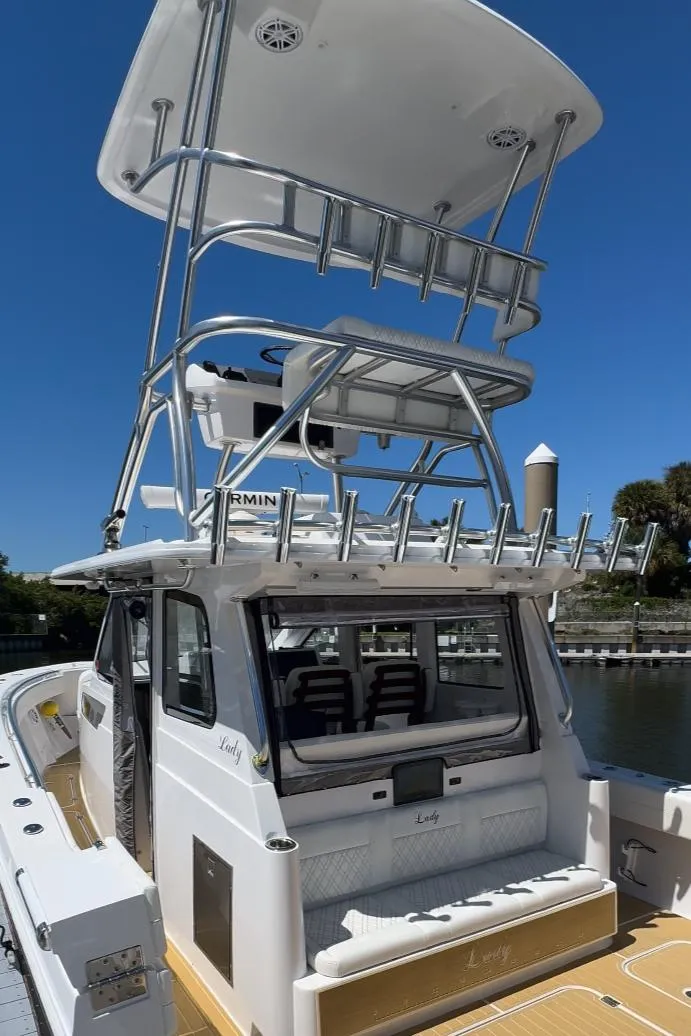 Slide: The Image of 2025 Century NAV4100 CC-H boat with twin engines, featuring a sleek design and spacious deck. - 20