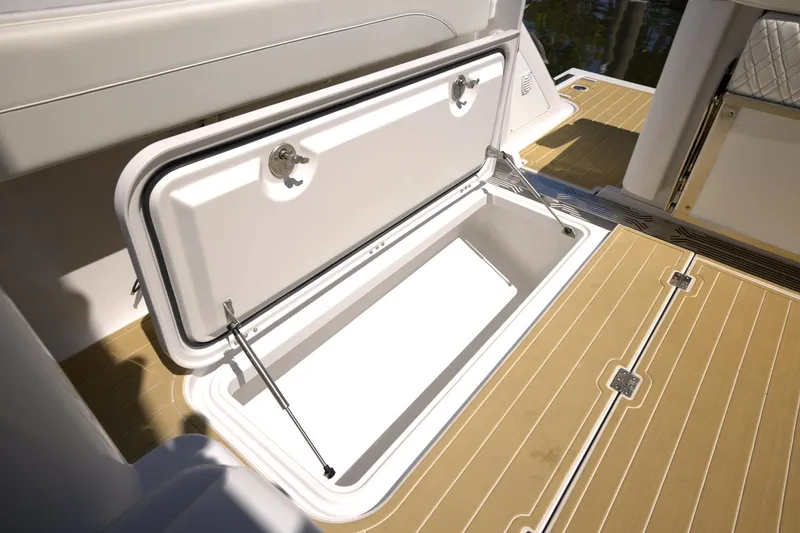 Slide: The Image of Open storage compartment on 2025 Century NAV4100 CC-H boat deck. - 24