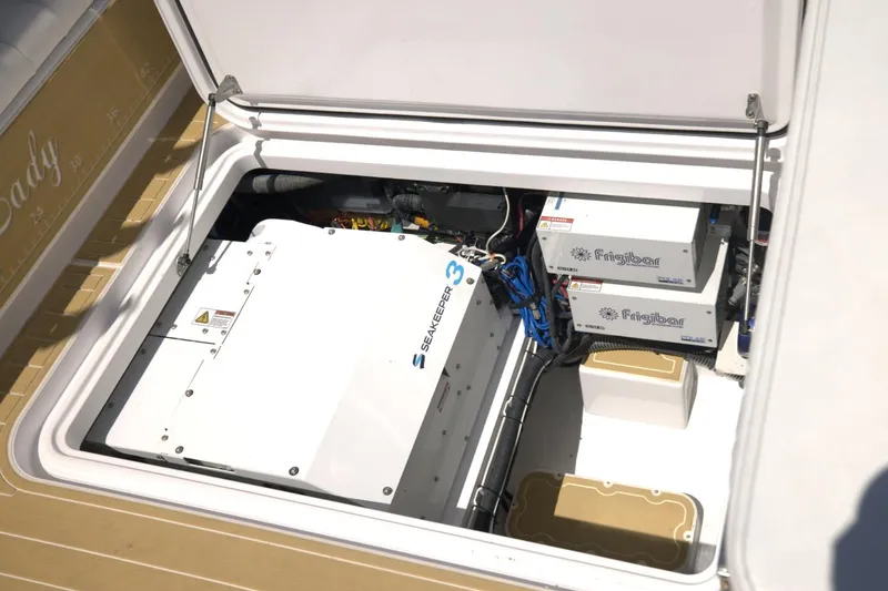 Slide: The Image of 2025 Century NAV4100 CC-H boat engine compartment with SeaKeeper and Firefly components. - 25