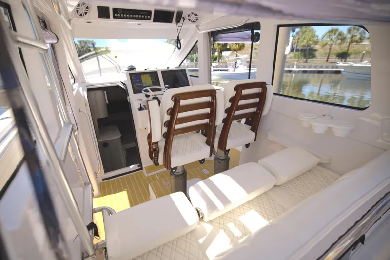 Slide: The Image of Interior of 2025 Century NAV4100 CC-H boat with twin seats and modern controls. - 33