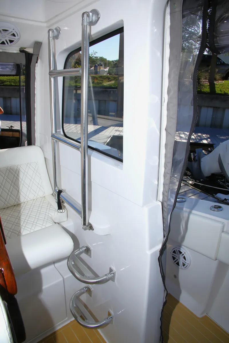Slide: The Image of Interior of 2025 Century NAV4100 CC-H boat with seating and ladder. - 40