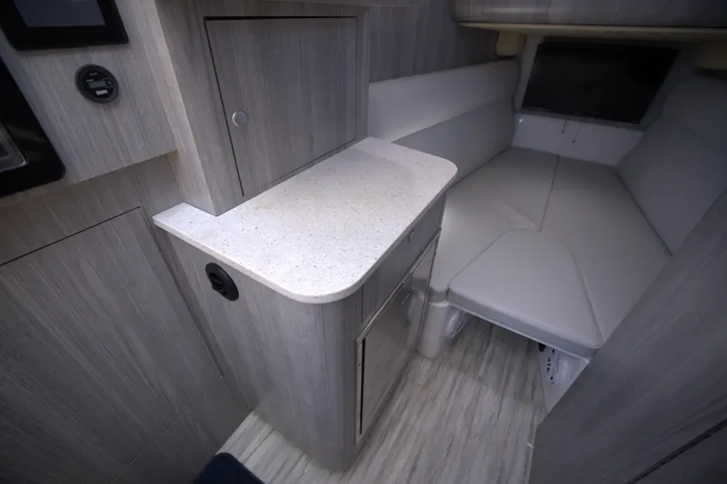 Slide: The Image of Interior of 2025 Century NAV4100 CC-H boat, featuring modern cabinetry and seating. - 45