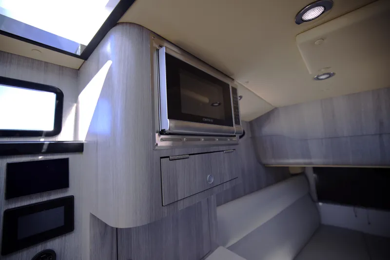 Slide: The Image of Interior of 2025 Century NAV4100 CC-H boat with modern kitchen amenities. - 46