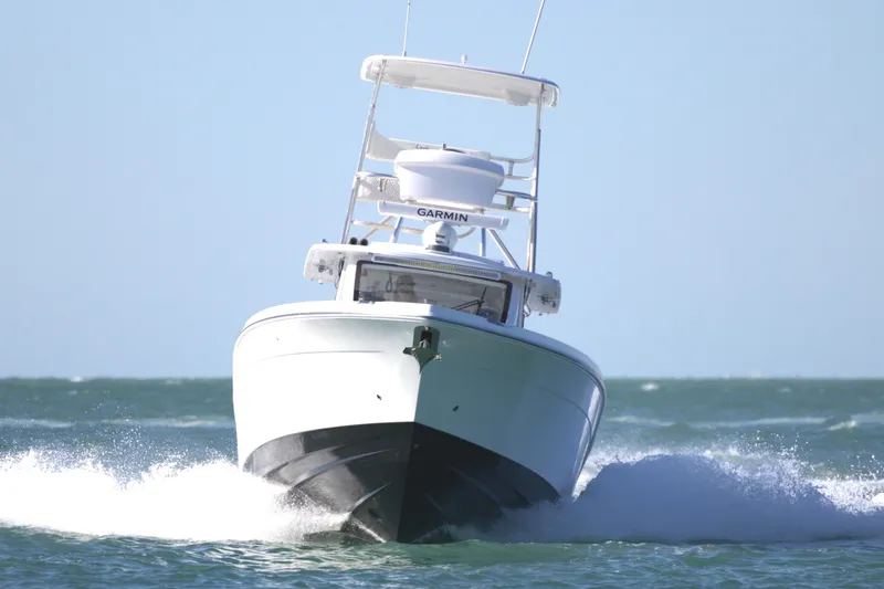 Slide: The Image of 2025 Century NAV4100 CC-H boat cruising on open water. - 6