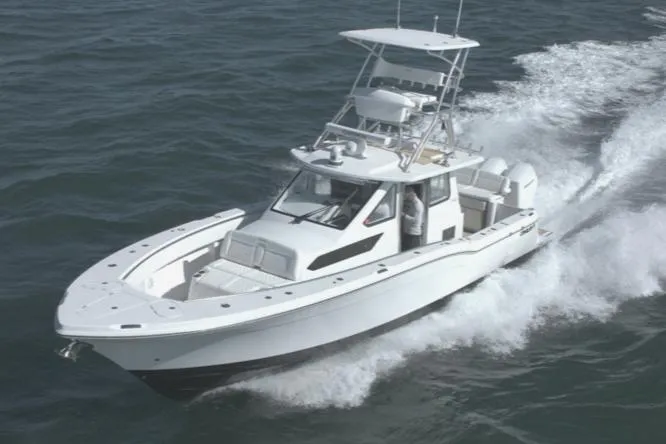 Slide: The Image of 2025 Century NAV4100 CC-H boat cruising on open water. - 7