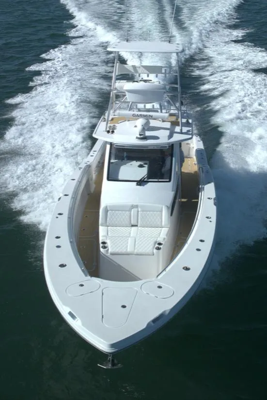 Slide: The Image of 2025 Century NAV4100 CC-H boat cruising on open water, showcasing sleek design and performance. - 8