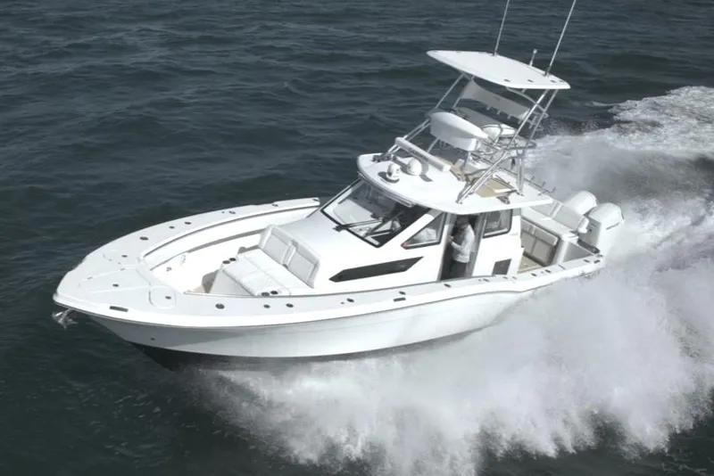 Slide: The Image of 2025 Century NAV4100 CC-H boat cruising on open water. - 9