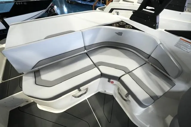 Slide: The Image of 2025 Bayliner V20i boat interior with sleek seating and cup holders. - 10