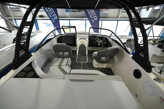 Slide: The Image of 2025 Bayliner V20i boat interior with modern seating and sleek dashboard design. - 2