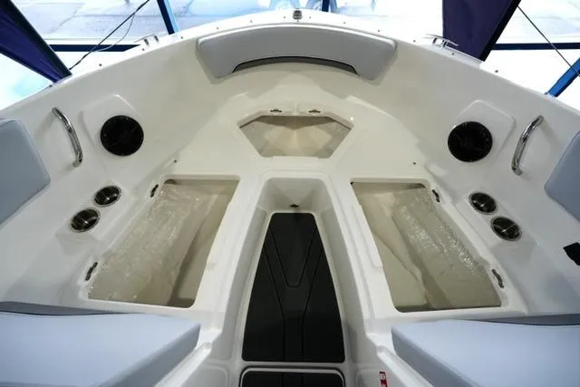 Slide: The Image of Interior view of 2025 Bayliner V20i boat, featuring spacious seating and modern design. - 4