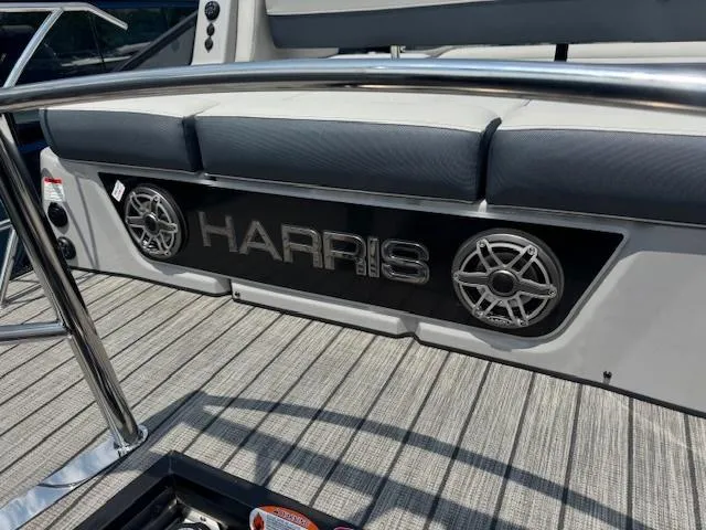 Slide: The Image of 2025 Harris Grand Mariner 250 boat interior with logo and speakers on deck. - 11