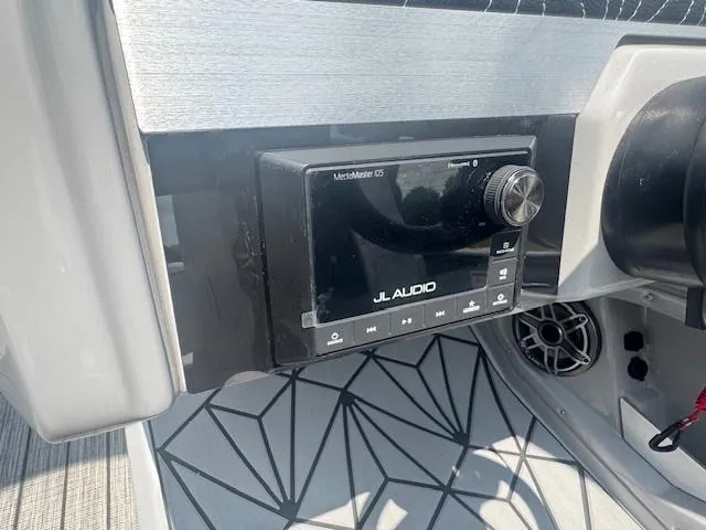 Slide: The Image of JL Audio system on 2025 Harris Grand Mariner 250 boat dashboard. - 14