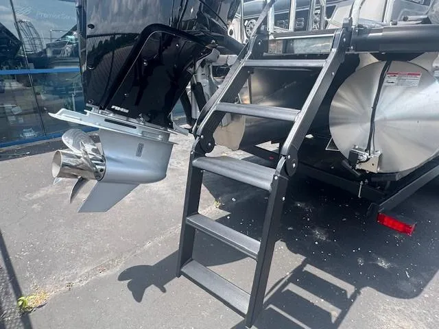 Slide: The Image of 2025 Harris Grand Mariner 250 boat with ladder and outboard motor. - 15