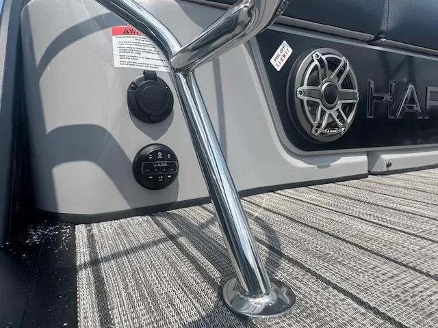 Slide: The Image of 2025 Harris Grand Mariner 250 boat interior with speaker and chrome railing. - 16