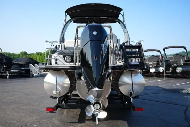 Slide: The Image of 2025 Harris Grand Mariner 250 pontoon boat, rear view with powerful outboard motor. - 22