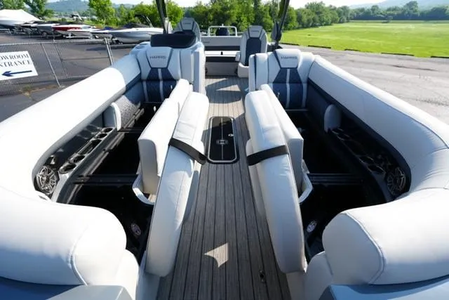 Slide: The Image of 2025 Harris Grand Mariner 250 pontoon boat interior with luxurious seating and sleek design. - 25