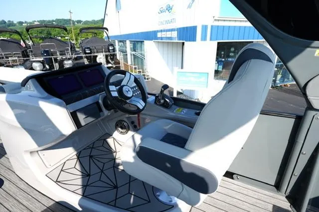 Slide: The Image of 2025 Harris Grand Mariner 250 helm with modern controls and comfortable seating. - 28