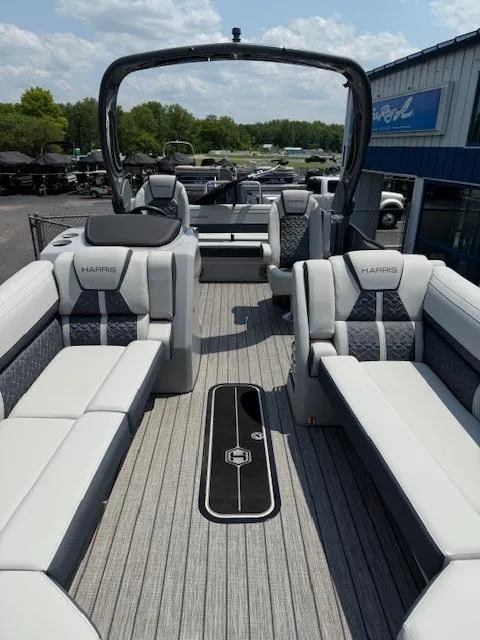 Slide: The Image of 2025 Harris Grand Mariner 250 pontoon boat with luxurious seating and sleek design. - 3