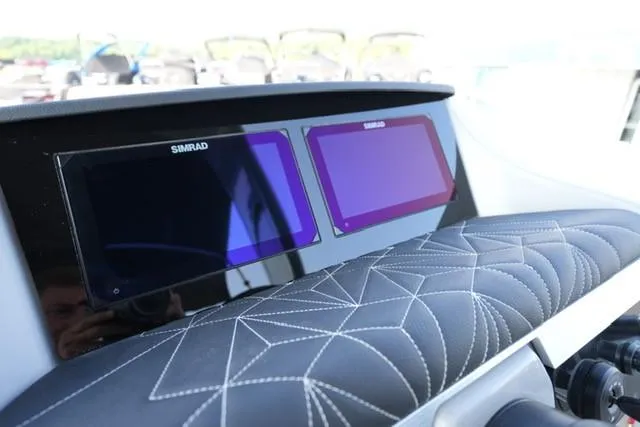 Slide: The Image of Dashboard of 2025 Harris Grand Mariner 250 with dual Simrad displays. - 30