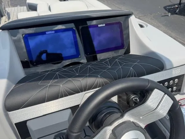 Slide: The Image of 2025 Harris Grand Mariner 250 dashboard with dual Simrad displays and stylish black leather trim. - 7