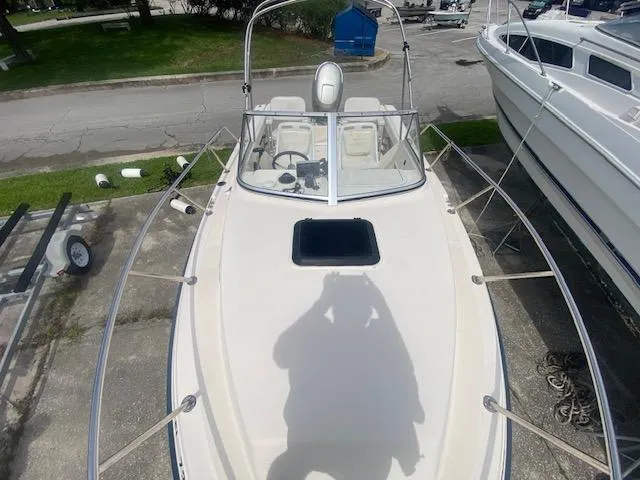 Slide: The Image of Top view of a 2003 Key West 2020 Walkaround boat docked on land. - 10