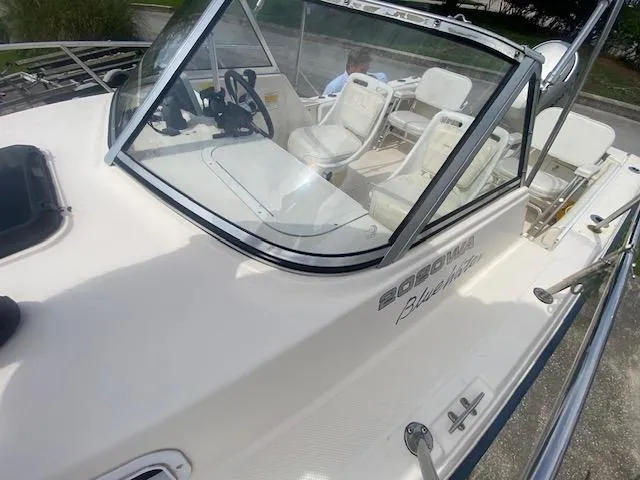 Slide: The Image of 2003 Key West 2020 Walkaround boat with white seating and steering console. - 11