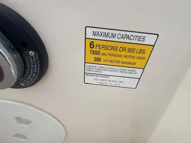Slide: The Image of Maximum capacity label on 2003 Key West 2020 Walkaround boat, 6 persons or 900 lbs. - 14