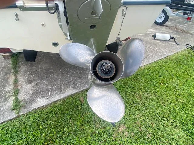 Slide: The Image of Propeller of 2003 Key West 2020 Walkaround boat on grass and concrete surface. - 16