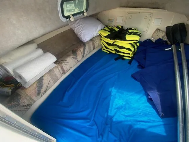 Slide: The Image of Interior cabin of 2003 Key West 2020 Walkaround with life jackets and bedding. - 17