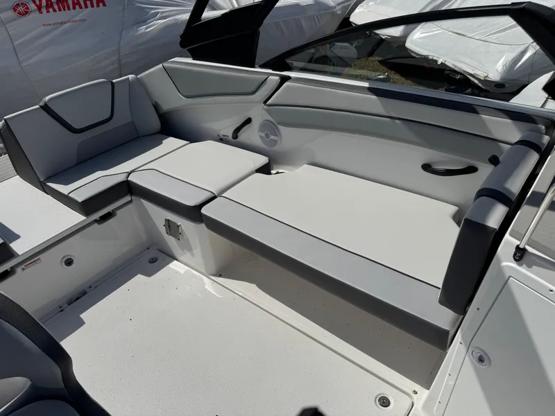 Slide: The Image of 2025 Yamaha Boats AR220 interior seating with modern design and comfortable upholstery. - 13