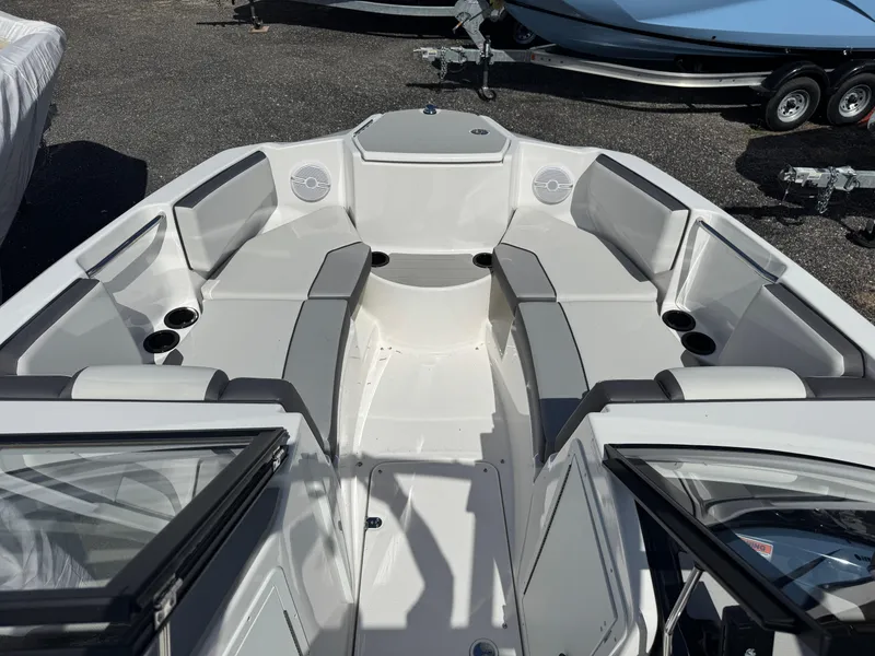 Slide: The Image of 2025 Yamaha Boats AR220 interior with spacious seating and modern design. - 7