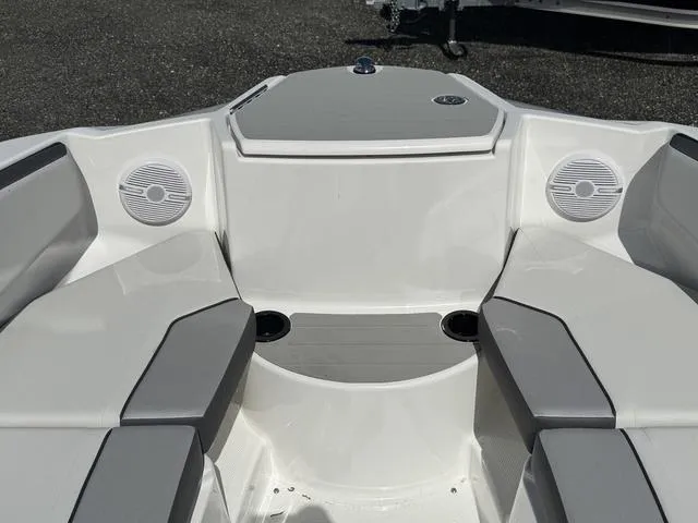Slide: The Image of 2025 Yamaha AR220 boat interior with gray seating and speakers. - 10