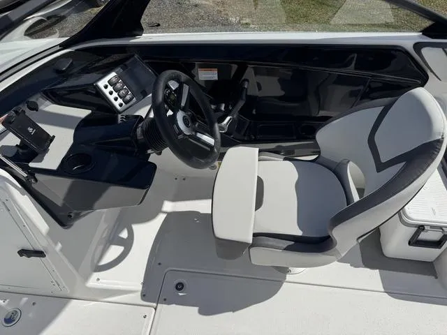 Slide: The Image of 2025 Yamaha Boats AR220 cockpit with modern steering and controls. - 18